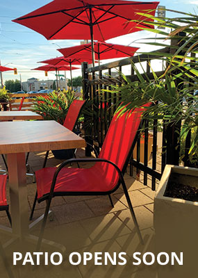 Pepe and Lela's Patio with red chair and sun umbrella